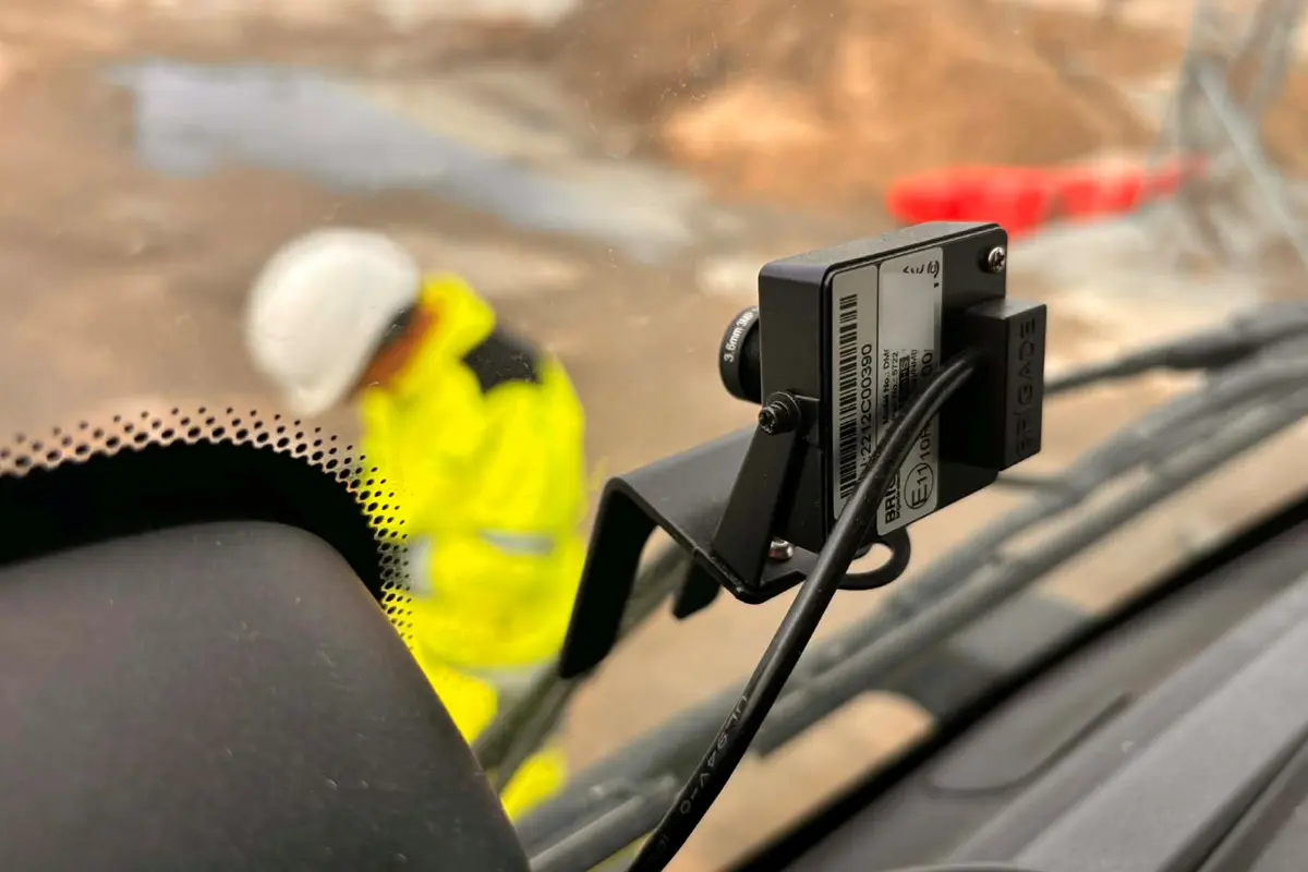 Brigade internal mini camera fitted inside the cab of a concrete umper truck detecting a construction worker walking infront