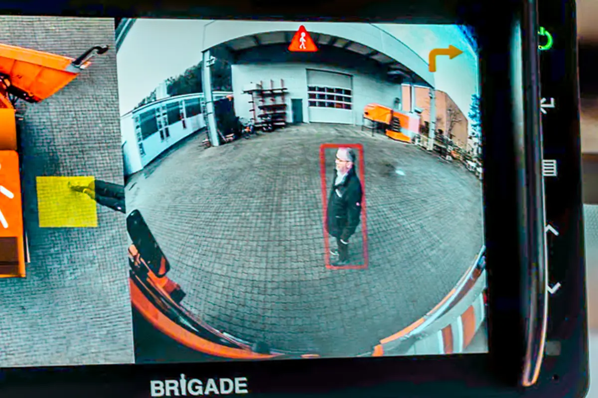 Monitor showing a pedestrian being detected by an ai camera