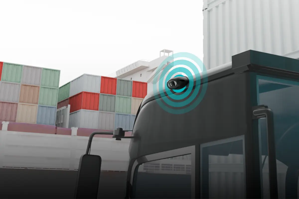 Backeye®360 AI fitted to tractor trailer with cargo ship in background