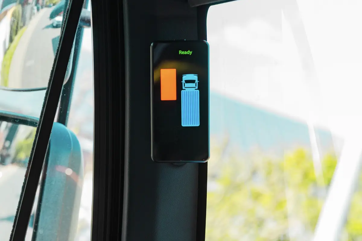 Radar Predict display unit inside the cab of a road seeper detecting an object on the side of the vehicle