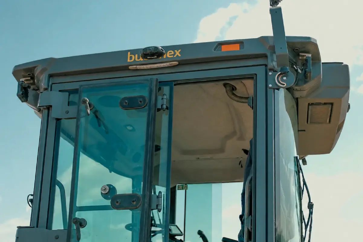 budimex-brigade-18-1200px Brigade Backeye®360 AI camera mounted to the top of a road roller cabin.